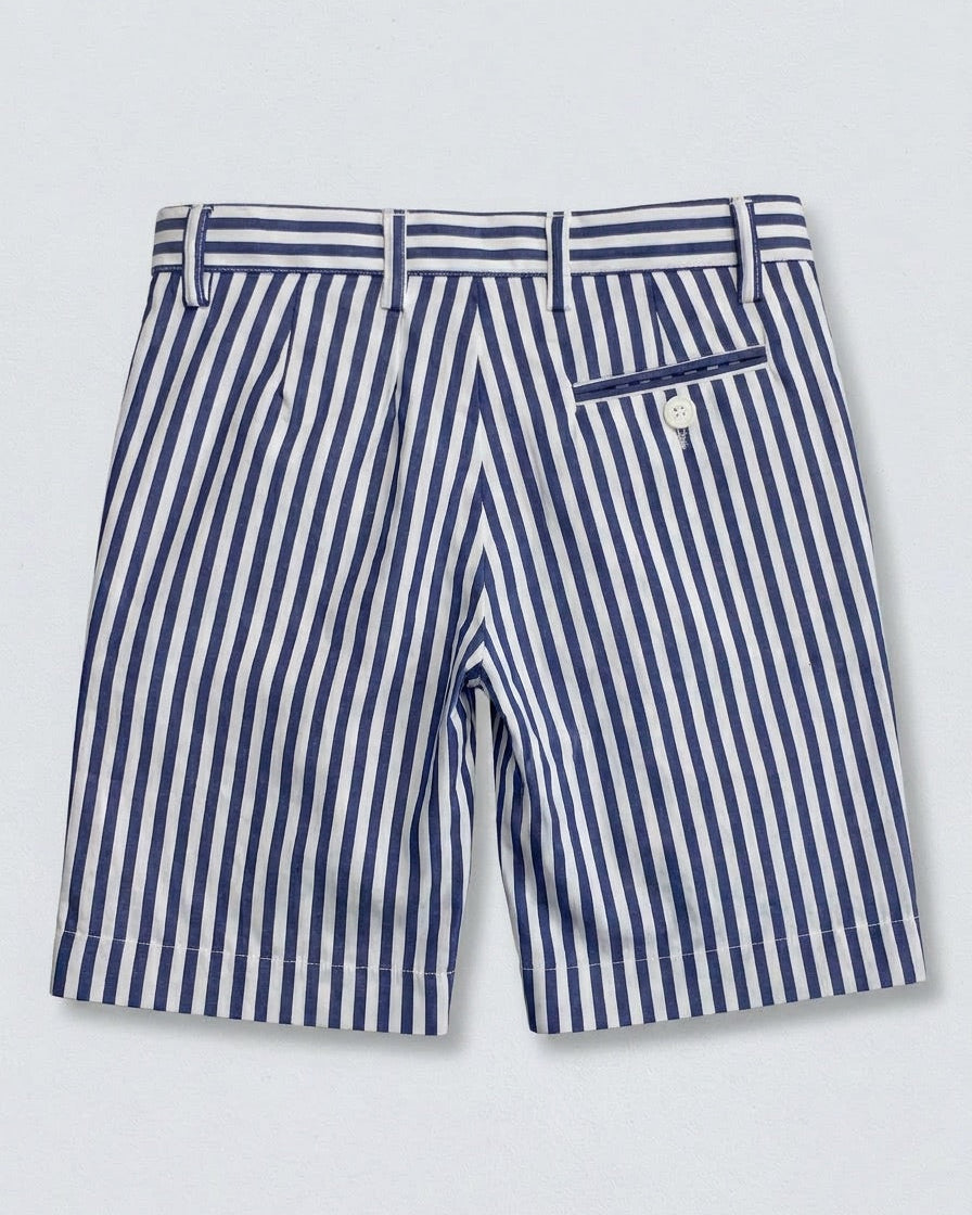 back of a pair of blue and white striped shorts with 4 visible belt loops and a white button and pocket on the right side, against a grey background