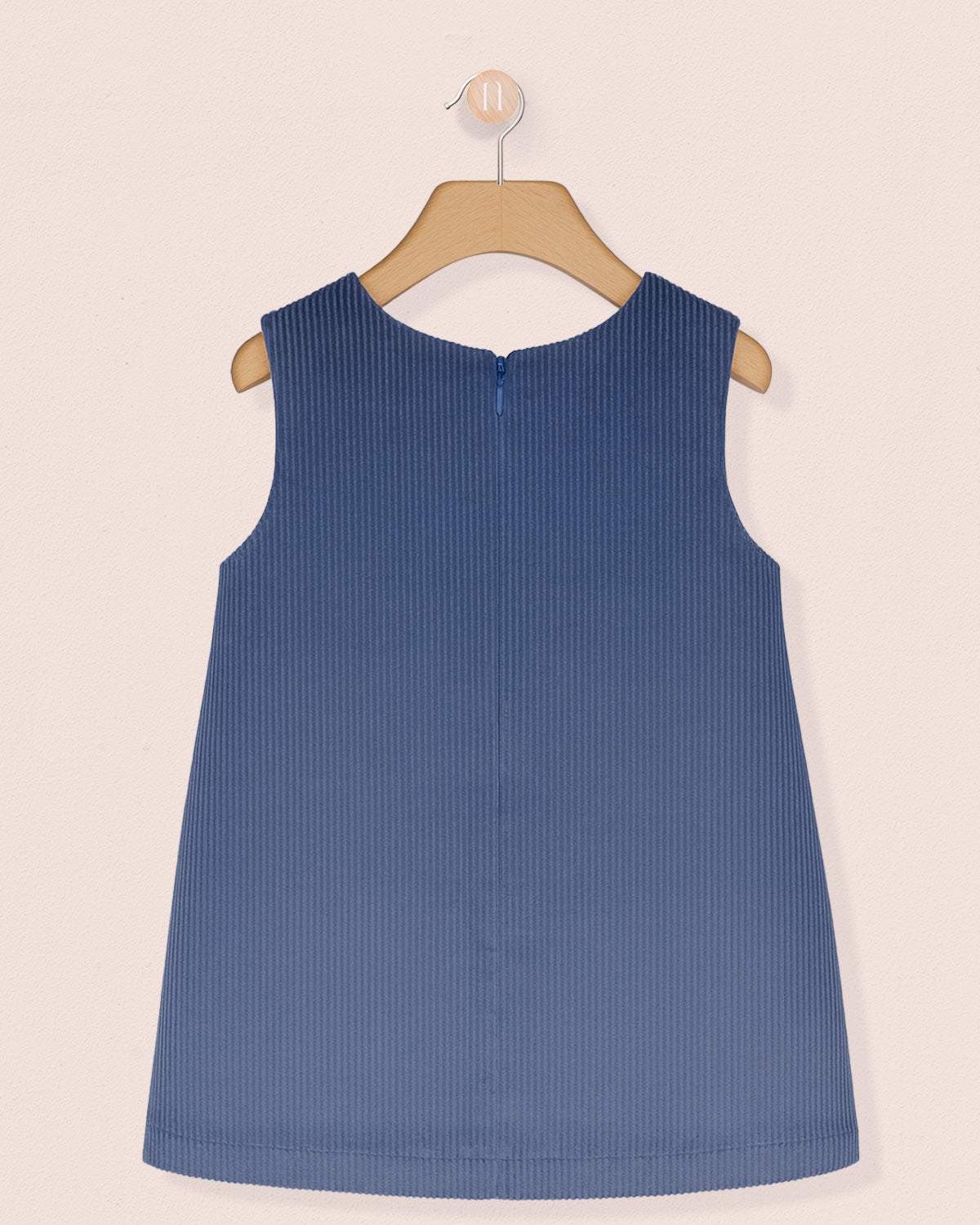 back of Blue sleeveless dress on a beige background