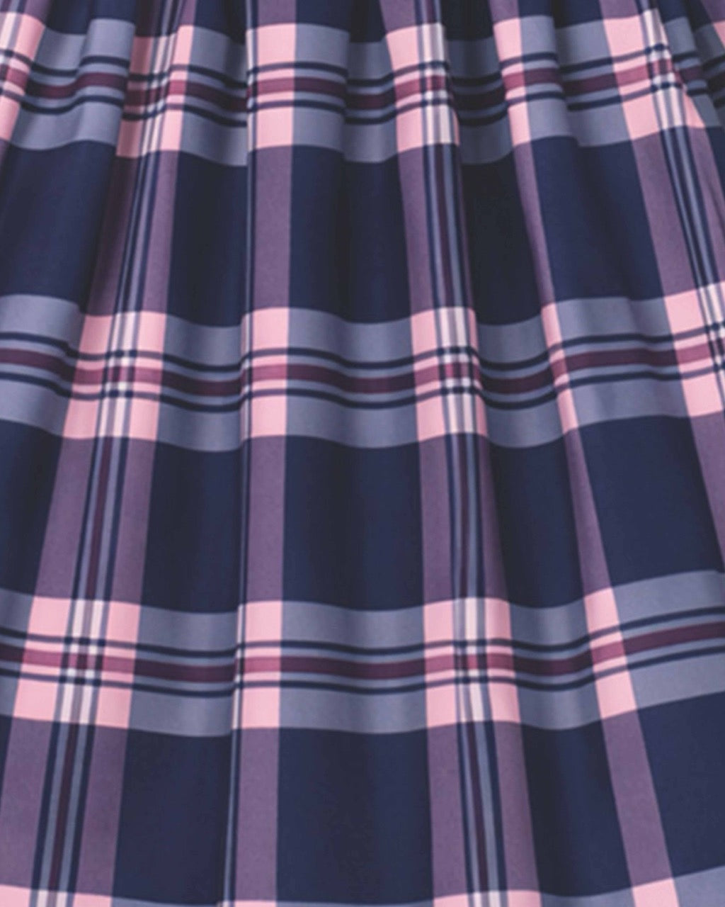Close-up of a plaid fabric with blue and pink patterns