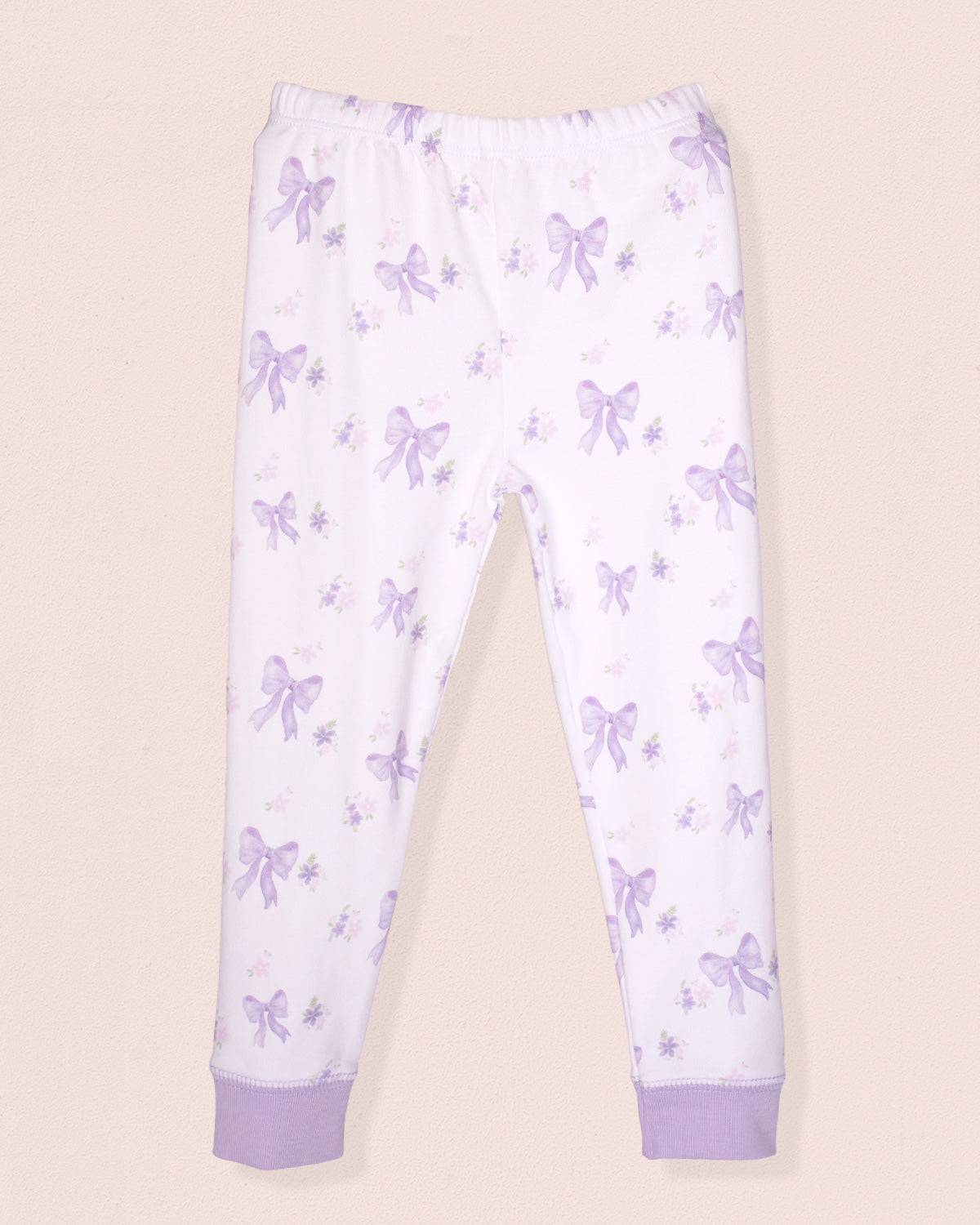 White pants with purple butterfly pattern on a beige background