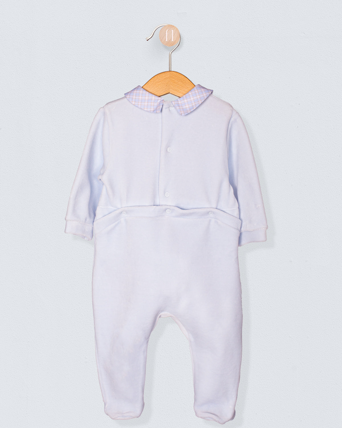 Back view of the light blue Italian velour footie with checkered collar and back snap closures, highlighting the smooth velour texture and soft tailoring.