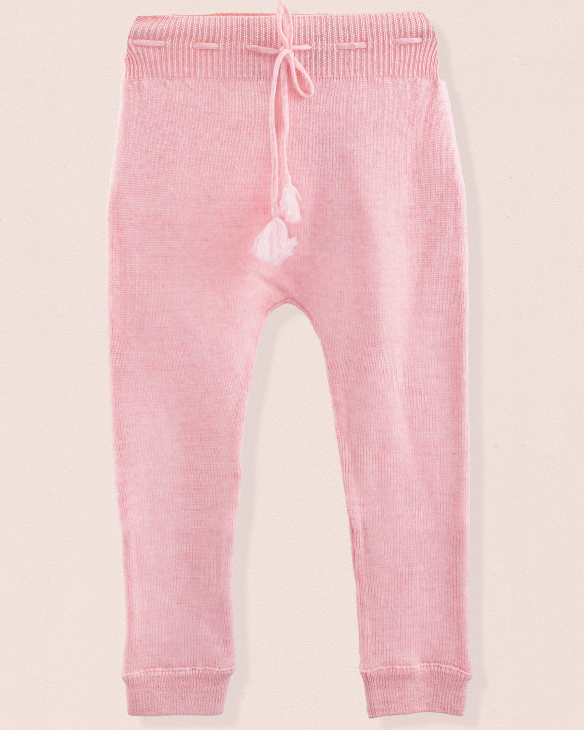 Pink knit legging on a light pink background