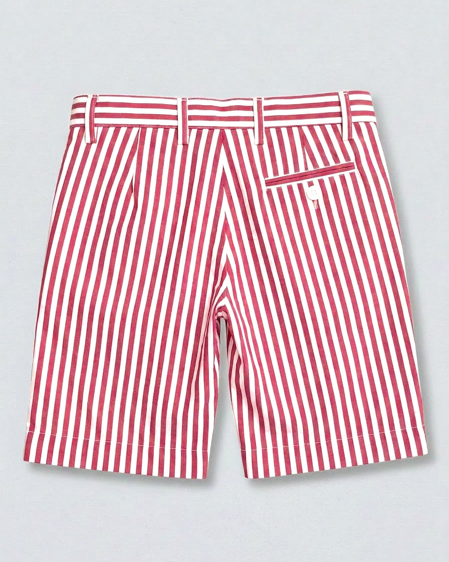 back of red and white striped shorts with 1 pocket and white button on right side, 4 visible belt loops, against a grey background.