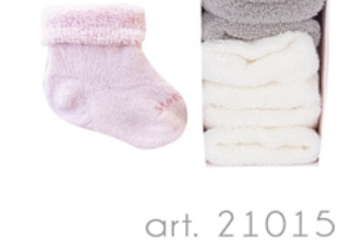 Story Loris 50Den Cream Tights feature a pink baby sock and a box with three white terry pieces, showcasing cozy essentials for little ones.