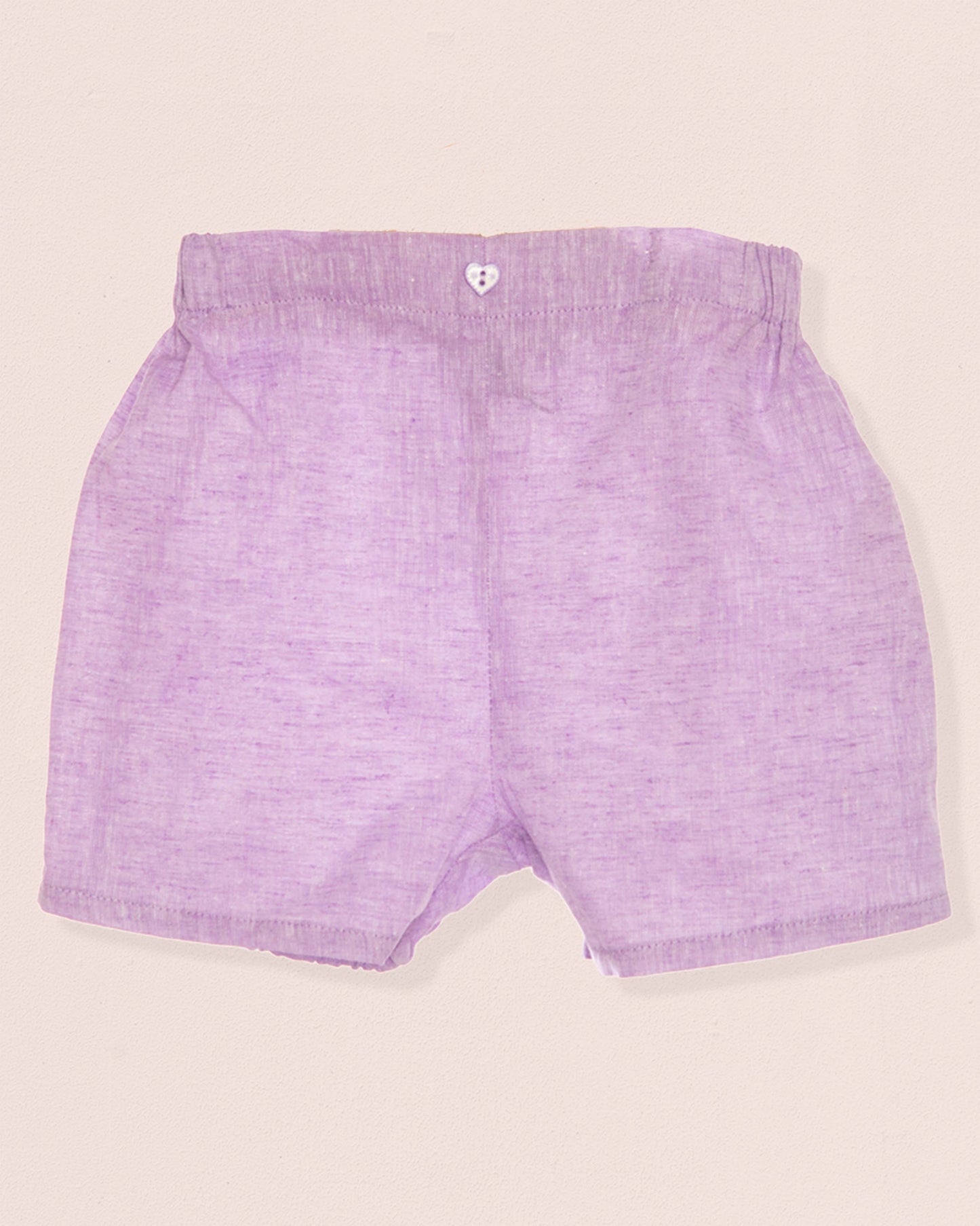 Purple shorts on a beige background