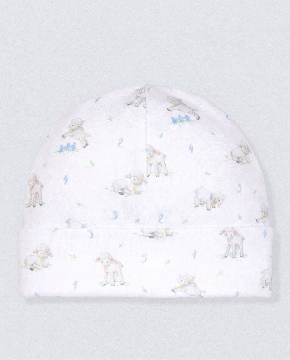 White hat with sheep designs, against a white background