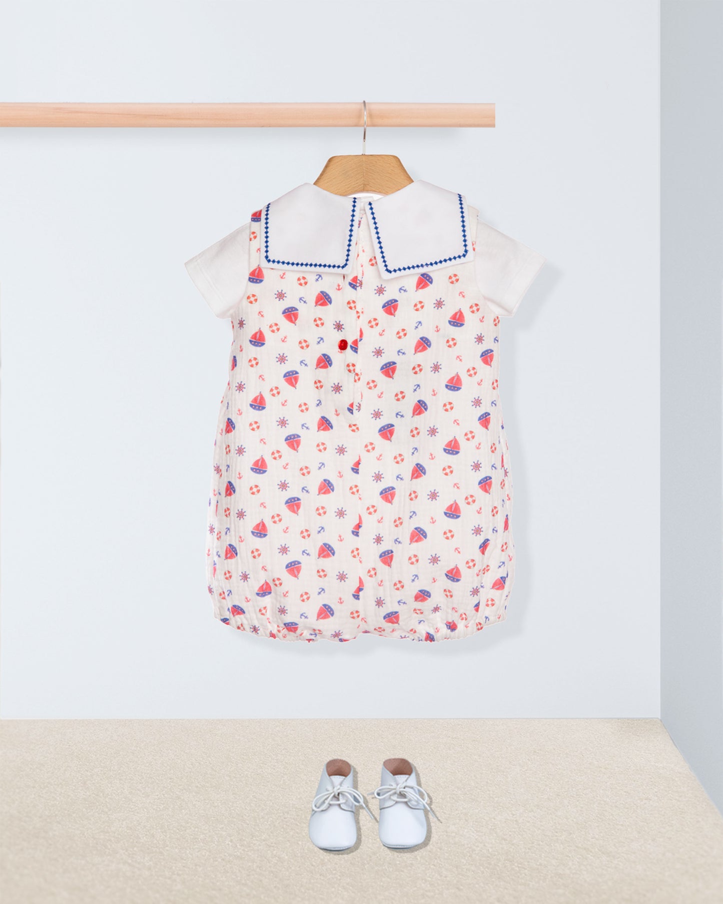 romper with boats print on hanger with shirt and shoes back