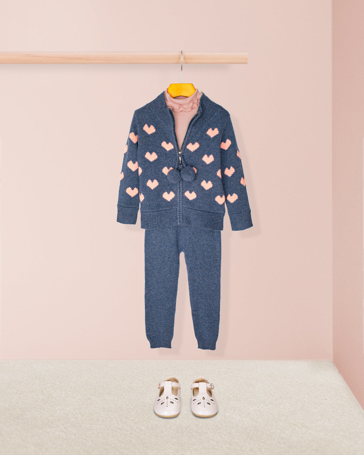girls outfit featuring jean-blue cashmere zip sweater with pompoms and pink hearts, cashmere jean blue leggings, rose ruffled turtleneck and leather buckle shoes in pink