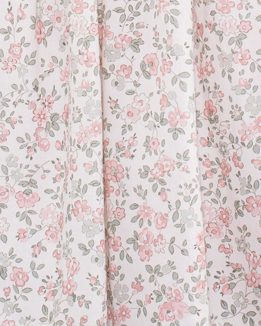 Close-up of floral cotton fabric on the Amanda Blush Garden Smocked Dress