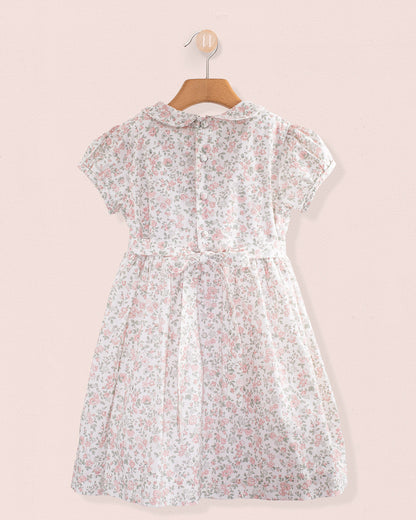 Back view of Amanda Blush Garden Smocked Dress showing button closure and sash ties