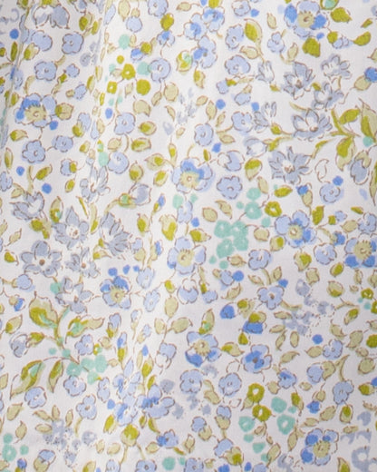 Close-up of floral fabric on Amanda Lauren Blue Floral Smocked Dress