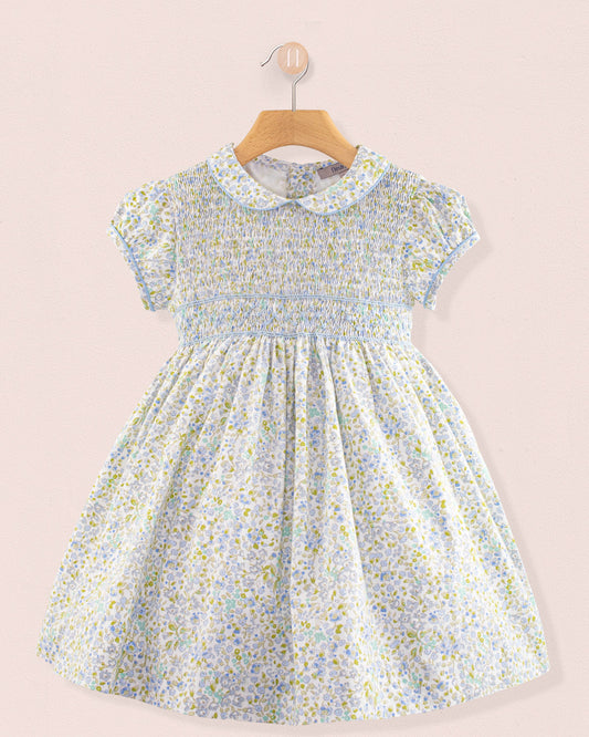 Front view of Amanda Lauren Blue Floral Smocked Dress on hanger