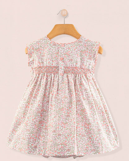 Back view of Baby Amelie Garden Pink Set showing the floral print dress with smocking detail and button closure