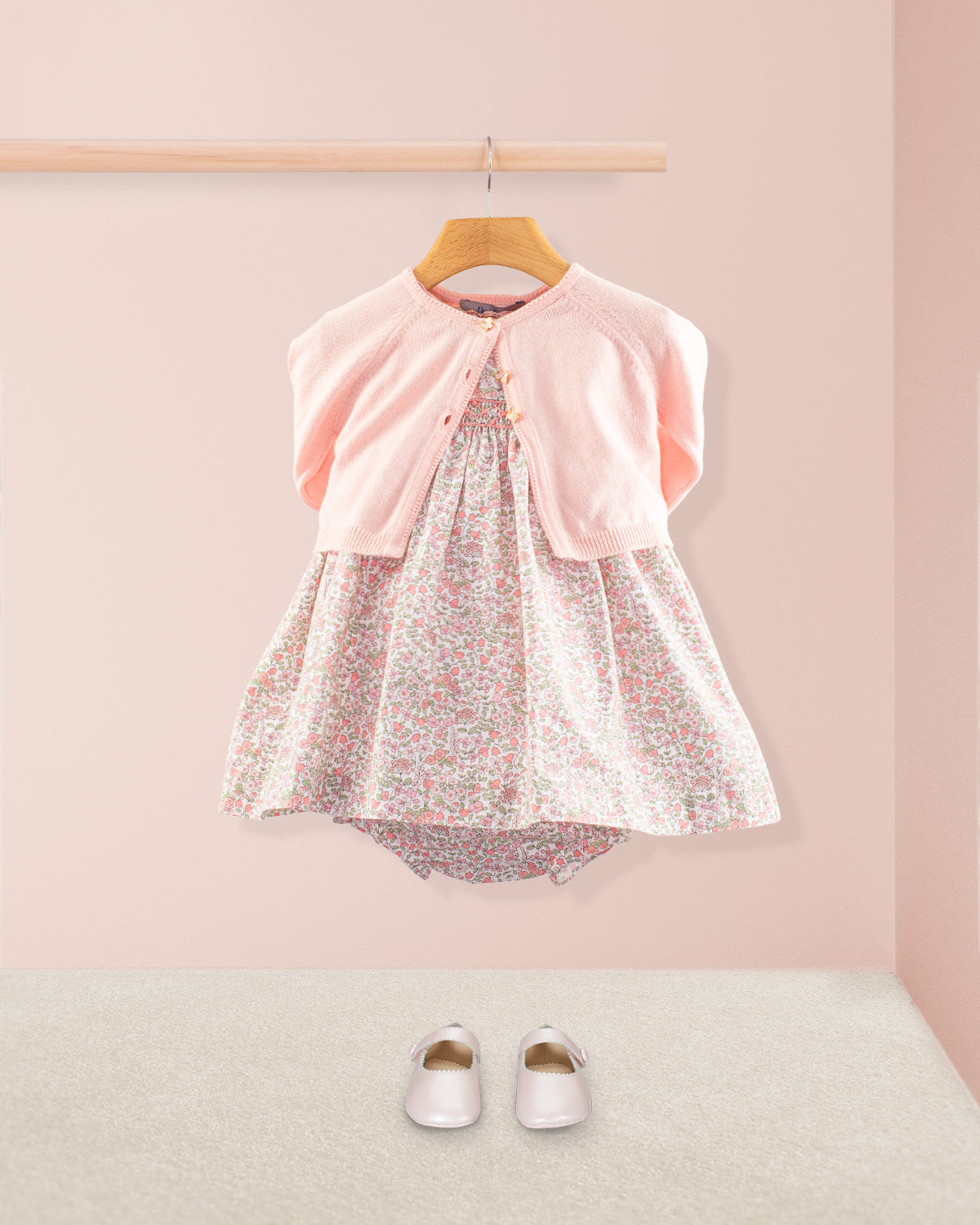 Baby Amelie Garden Pink Set layered with a petal pink cardigan and bloomers paired with pink Mary Jane shoes
