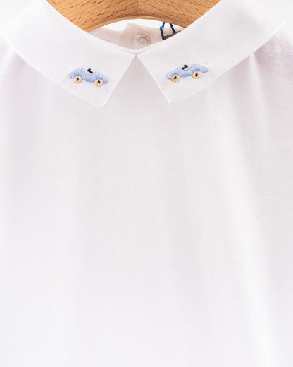 Close-up view of the white cotton onesie's collar, featuring detailed embroidery of two light blue cars with beige wheels on each collar point.