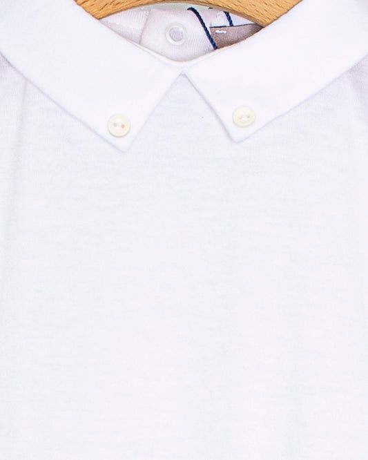 Close-up of the Andreas Onesie collar showing two small white corzo buttons stitched into the tips of the white collar.