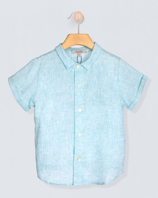 Aqua short-sleeve shirt on a hanger against a light gray background