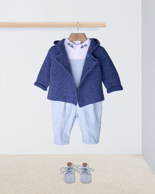Baby outfit with blue jacket, pants, and shoes on a white background