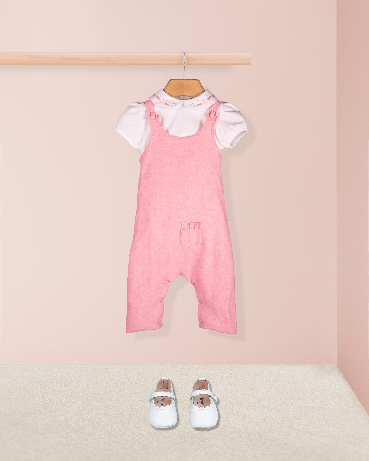 Aspen Candy Mélange pink knit overall paired with white embroidered collar onesie and white shoes