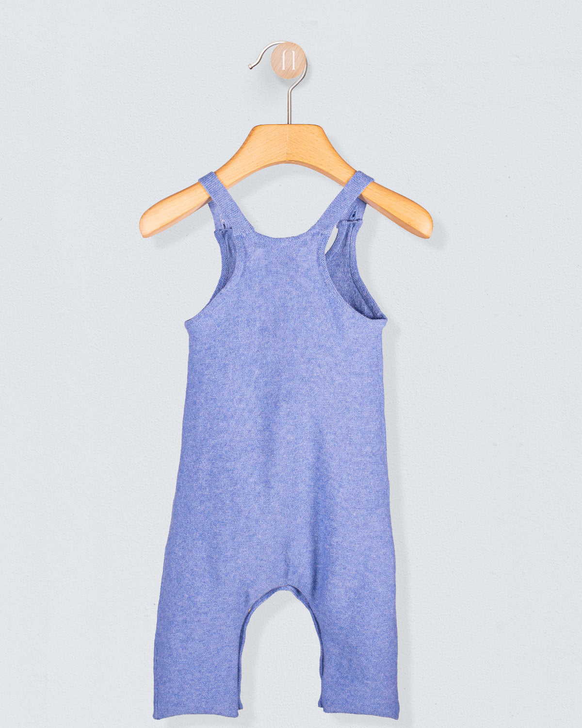 Back view of the Aspen Jean Mélange Overall showing full length and texture in denim blue cotton knit