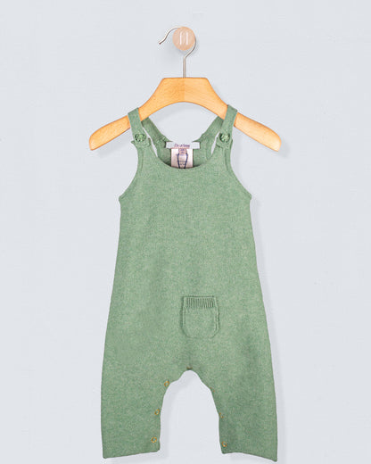 Aspen Sage Melange Cotton Knit Overall hanging on a wooden hanger against a light blue background
