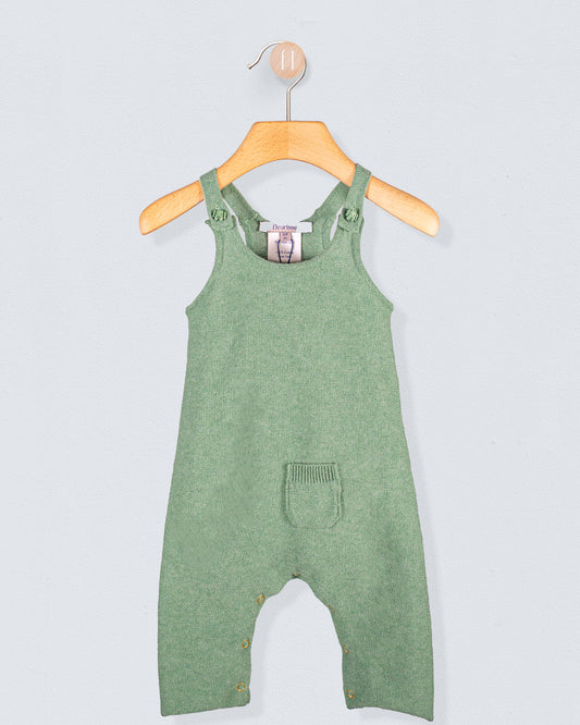 Aspen Sage Melange Cotton Knit Overall hanging on a wooden hanger against a light blue background