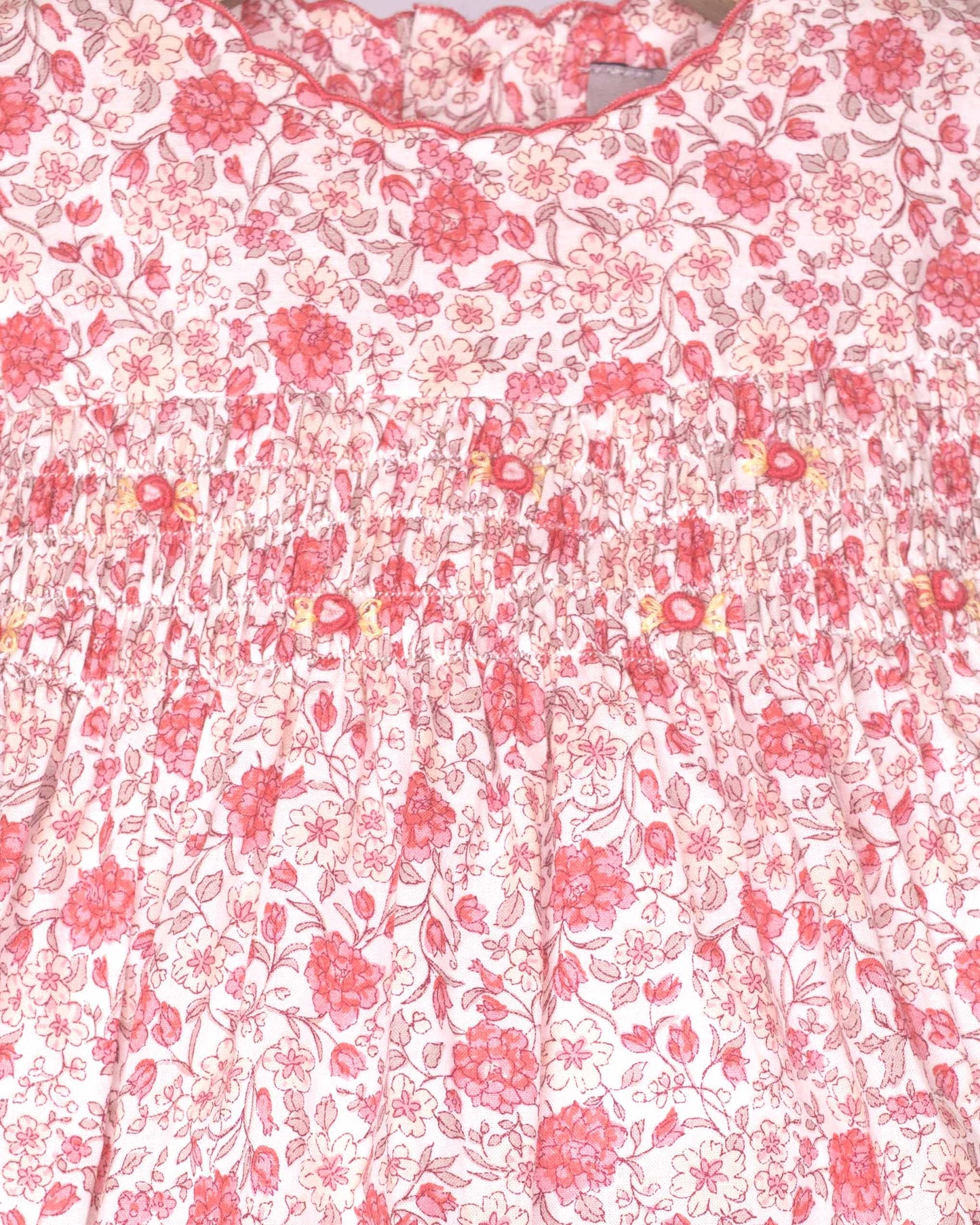 Floral patterned fabric with pink flowers on a white background