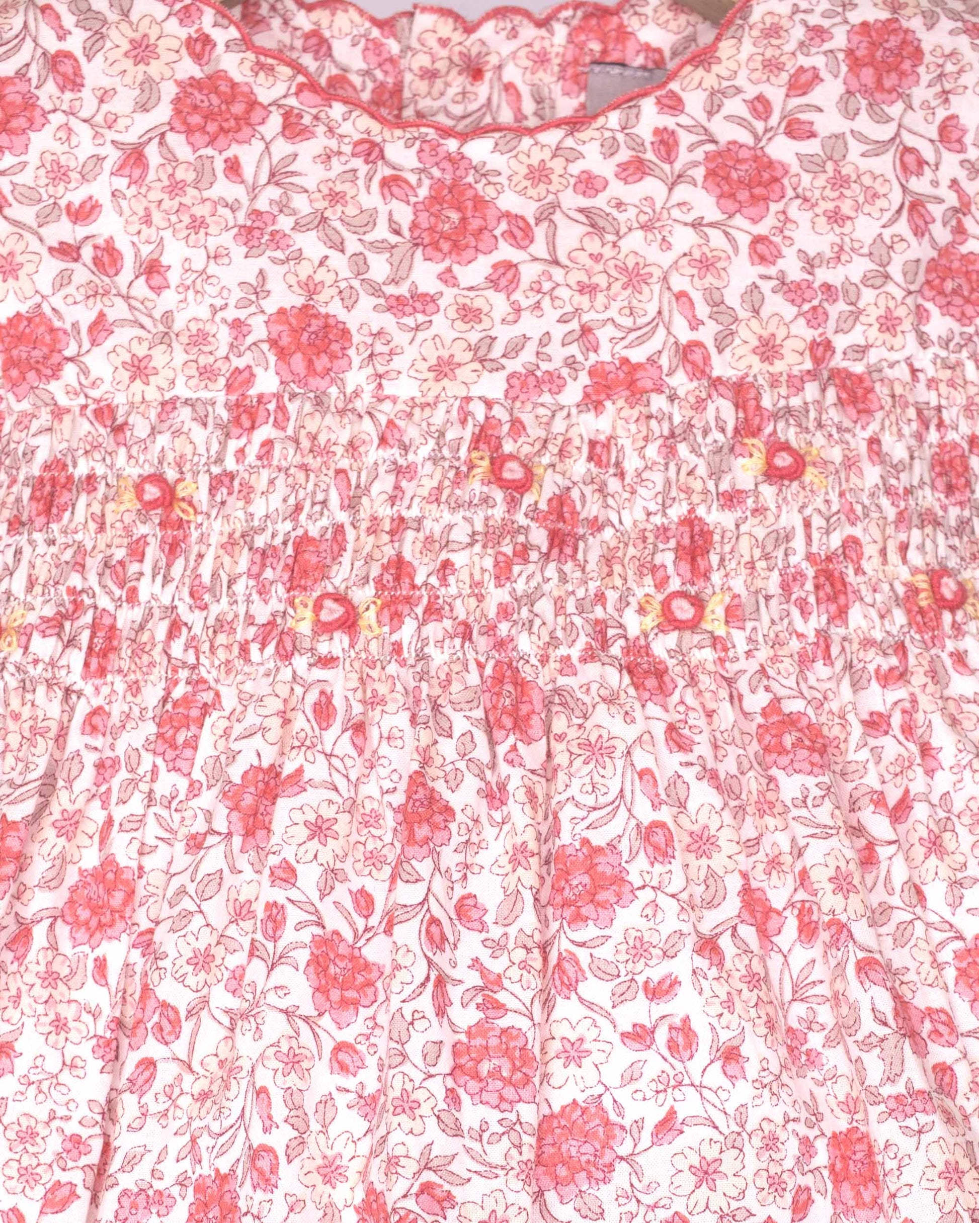 Floral patterned fabric with pink flowers on a white background
