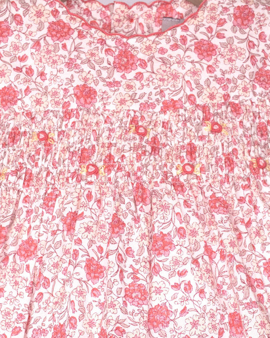 Floral patterned fabric with pink flowers on a white background
