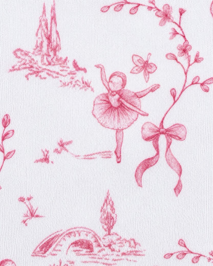 White fabric with a pink toile de Jouy pattern featuring a ballerina, flowers, a bow, and landscape motifs.