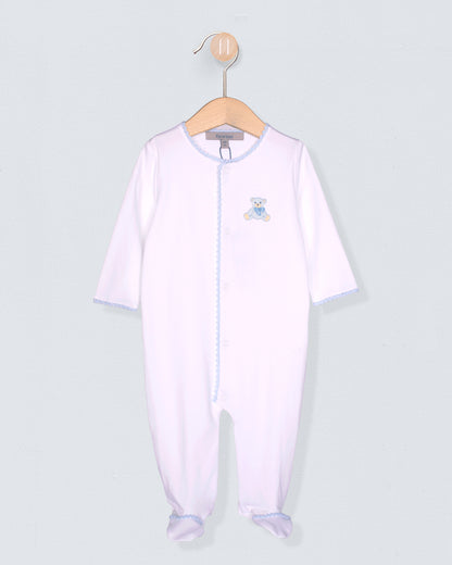 Baby onesie with a small design on a hanger against a light gray background