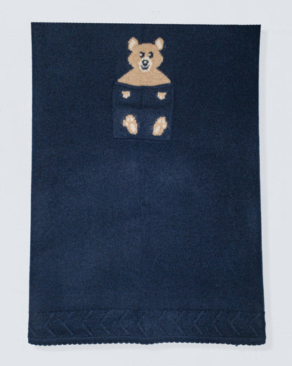 Navy blue cashmere blanket with a bear design in the center on a white background