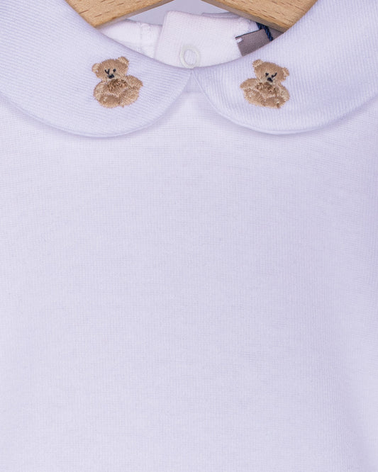 Close-up detail of the beige scalloped collar on a white cotton baby onesie, showcasing two hand-embroidered beige teddy bears with delicate stitching.
