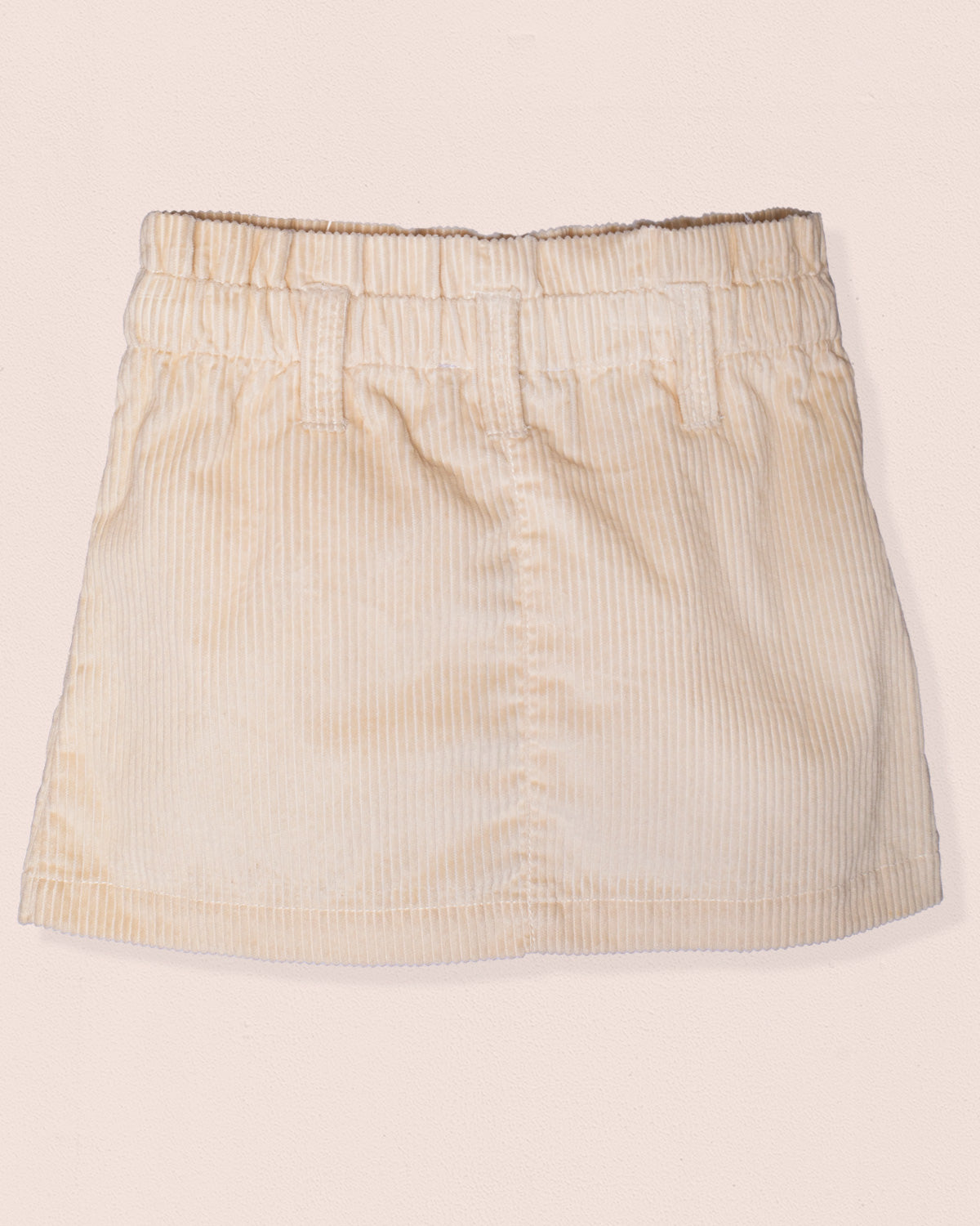 Beige striped skirt on a beige background