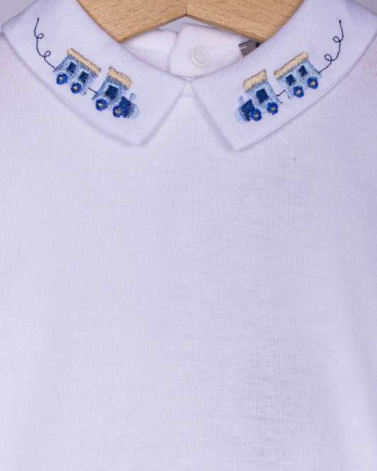 close-up White shirt collar with train embroidered blue designs on a white background