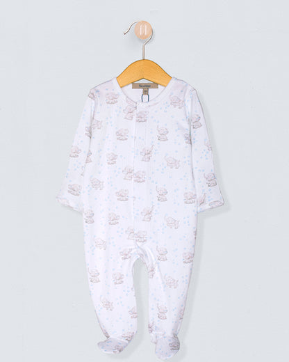 Baby onesie with a pattern on a hanger against a light gray background