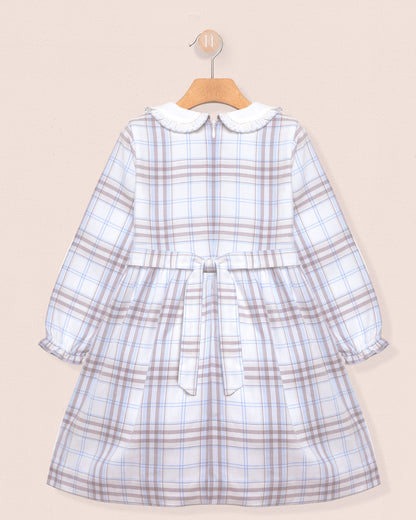 Plaid dress with a collar on a beige background