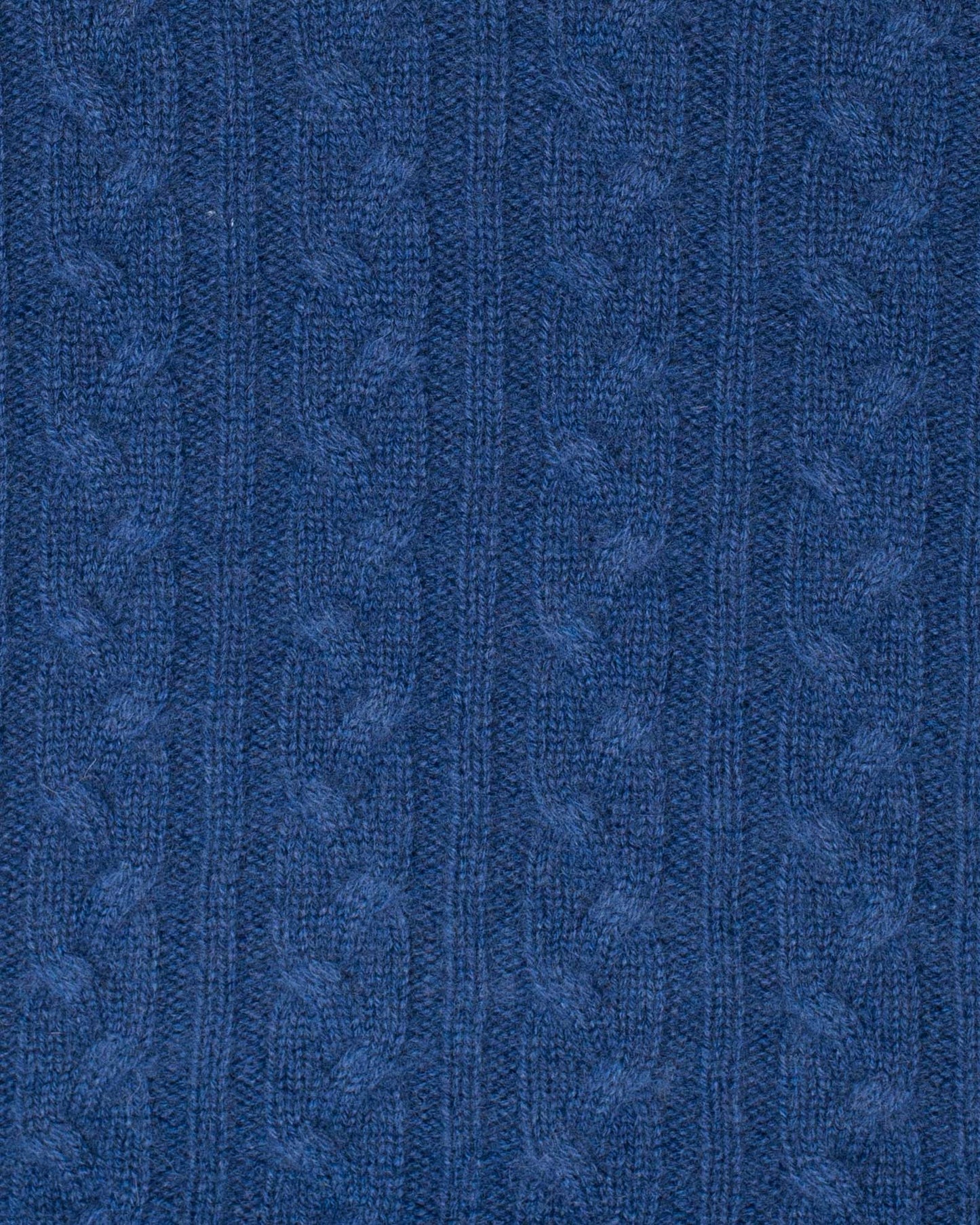 Close-up of blue textured fabric with a subtle pattern