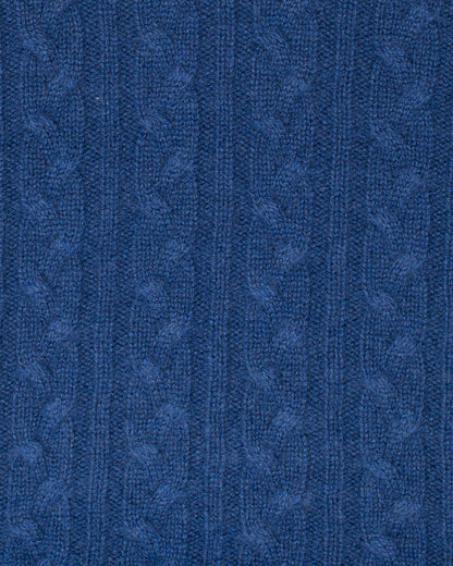 Close-up of blue textured fabric with a subtle pattern