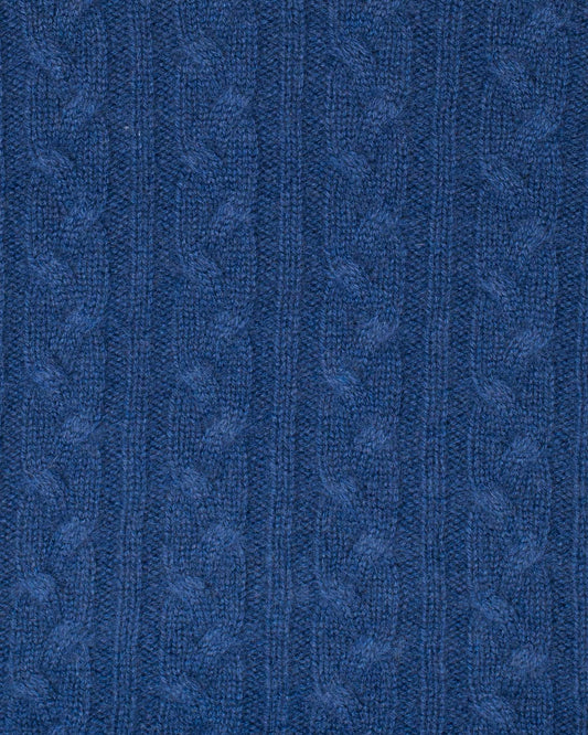 Close-up of blue textured fabric with a subtle pattern