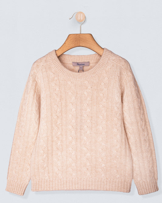 Beige cashmere sweater on a wooden hanger against a light gray background