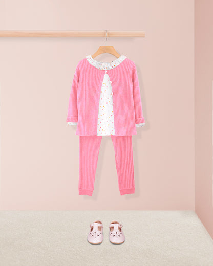 Pink children's outfit with a matching cardigan, top, and pants on a hanger against a pink background.
