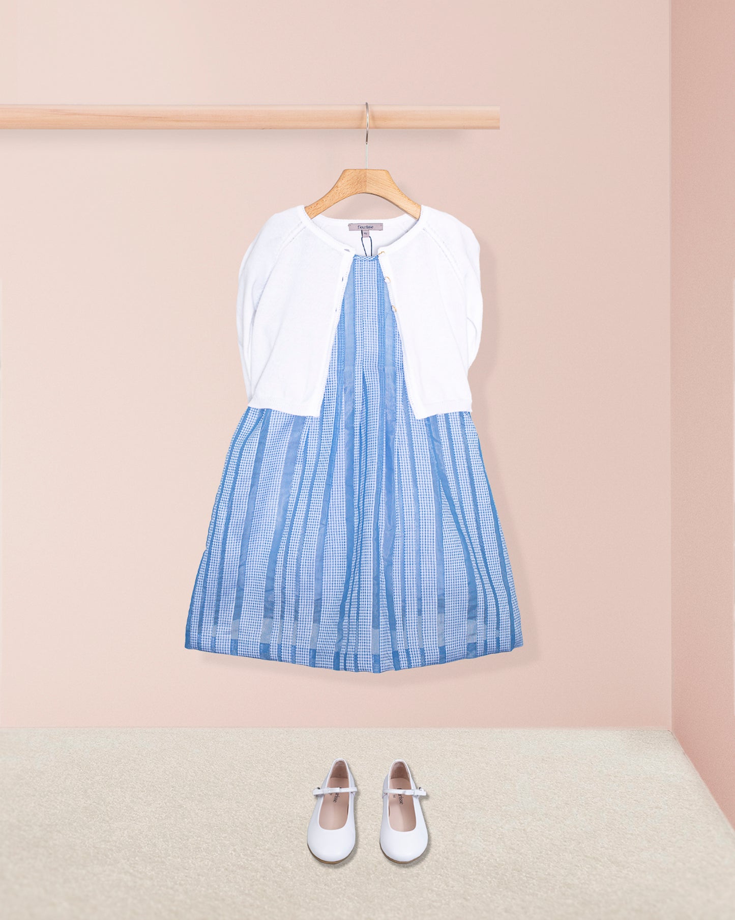 Carmel Italian Blue Chiffon Dress with shoes and a sweater on a hanger