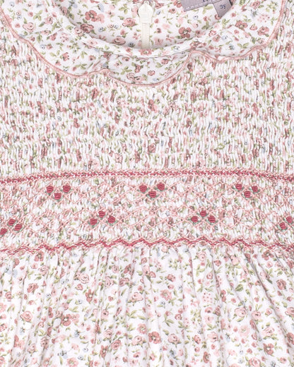 Floral patterned fabric with a visible brand label on a white background