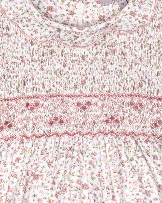 Floral patterned fabric with a visible brand label on a white background