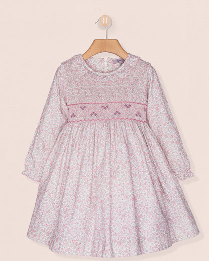 Floral dress with pink trim on a beige background
