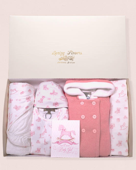 Baby gift set in gift box with pink and white hooded jacket and footie set in pink toys print with coordinating items in a box.