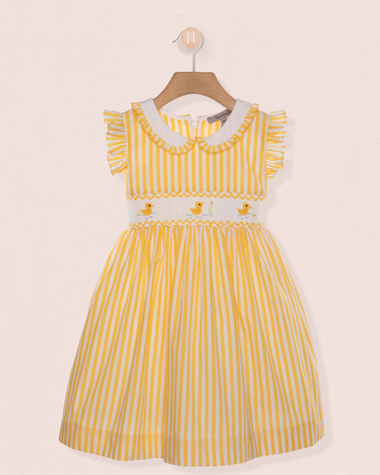 Yellow striped dress with white collar on a beige background