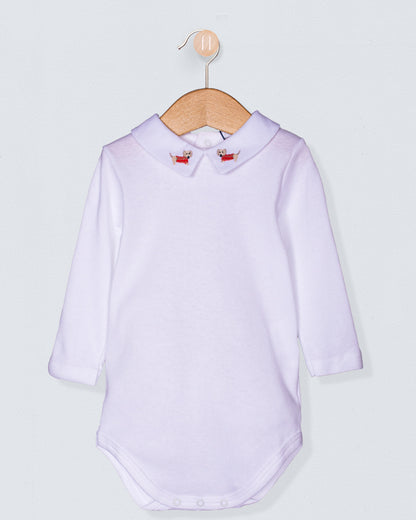 Italian cotton baby onesie with long sleeves and embroidered dachshund collar, displayed on a wooden hanger against a light background.