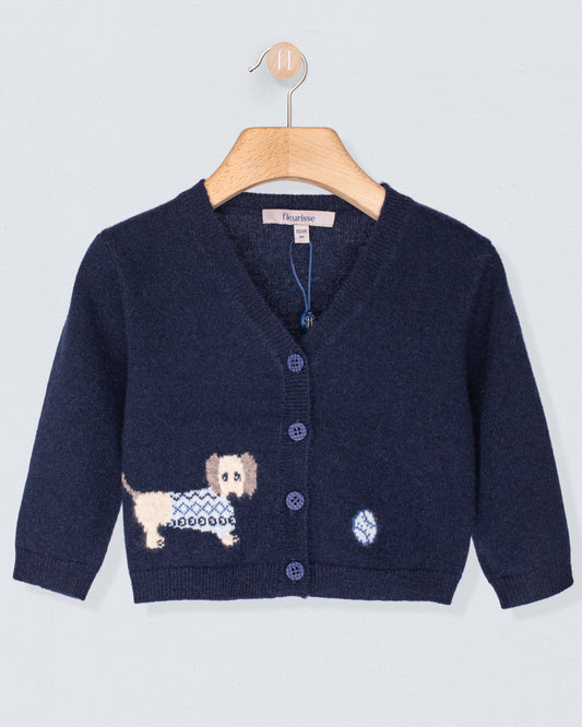 Navy blue cardigan with dog design on a hanger against a light gray background